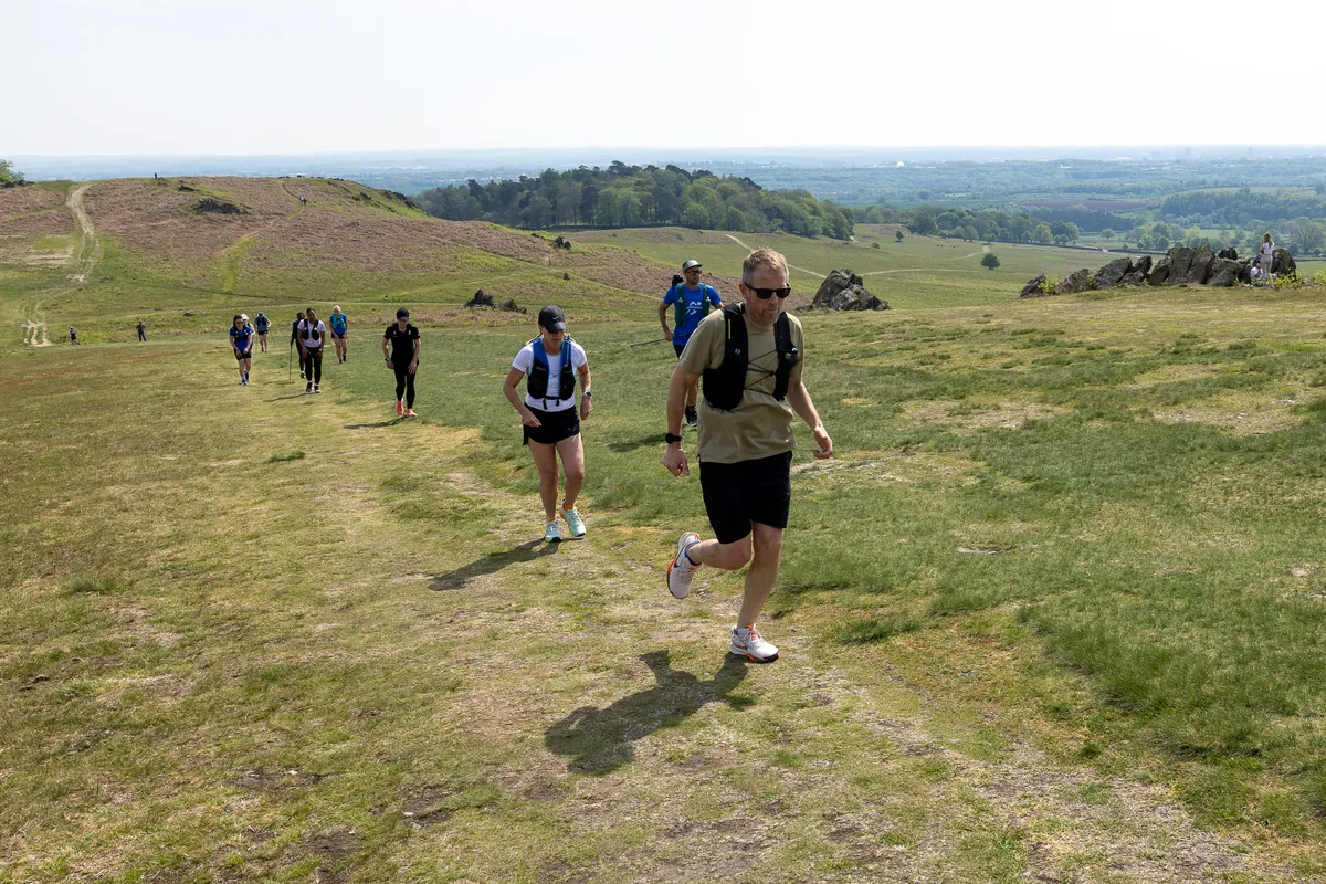 The group running together across the open trails